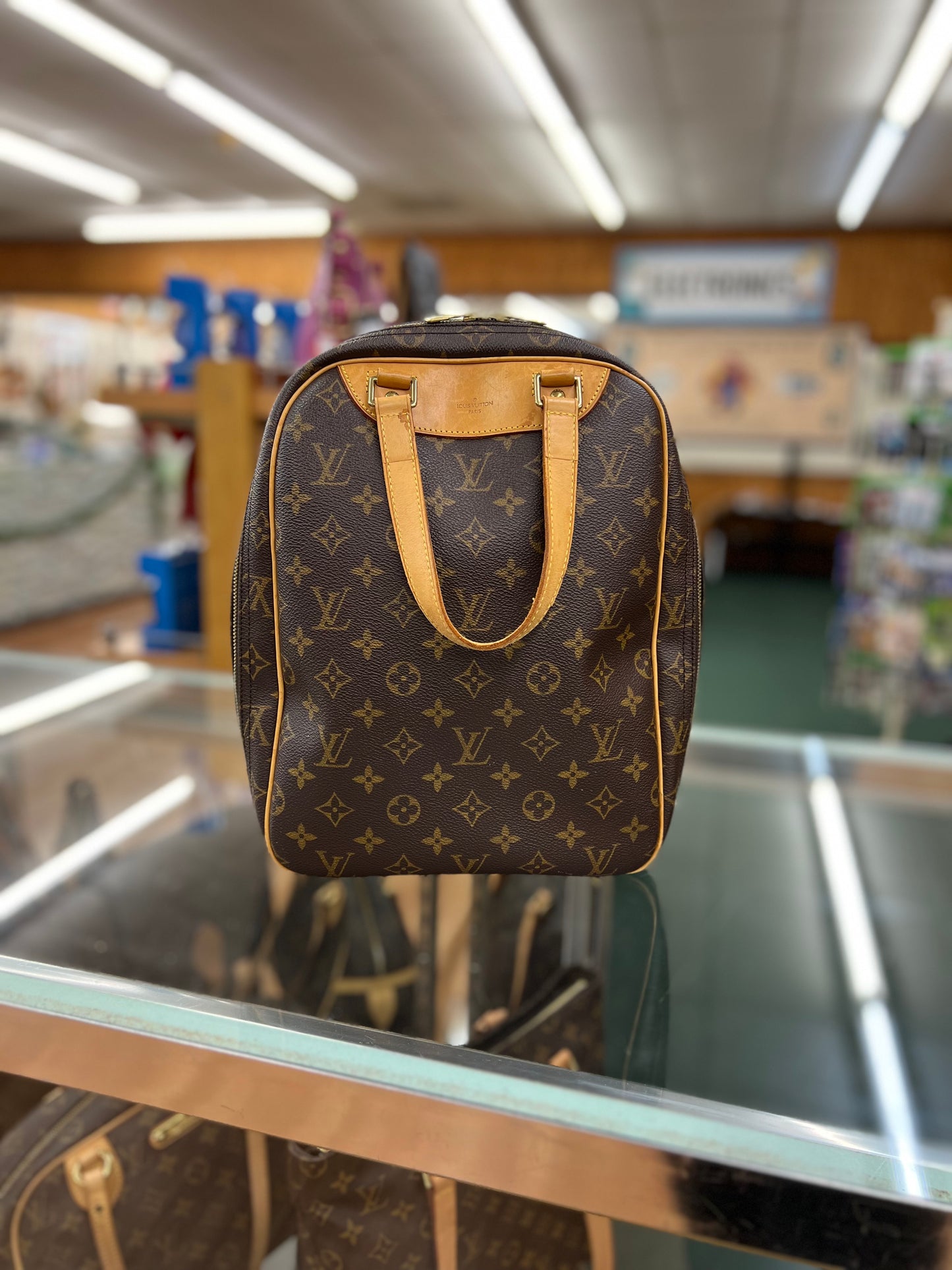 Louis Vuitton Monogram Excursion Handbag